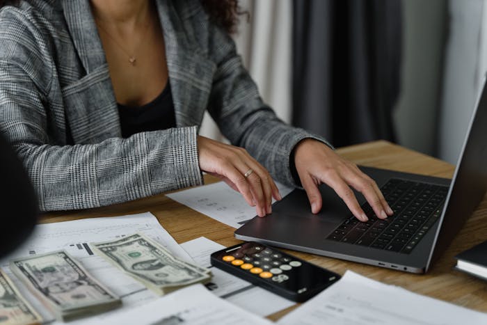 Woman on computer considering using quickbooks for landlords